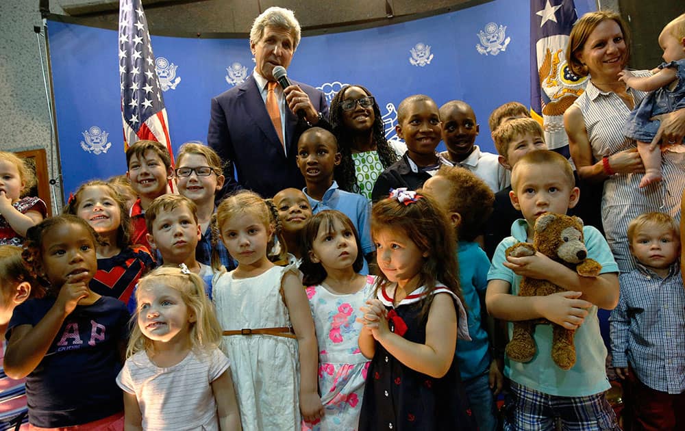 Secretary of State John Kerry meets with US embassy staff and their children at the embassy in Manama, Bahrain.