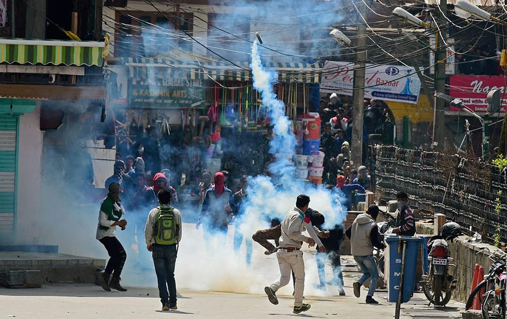 Protesters and security forces during clash in downtown area of Srinagar.