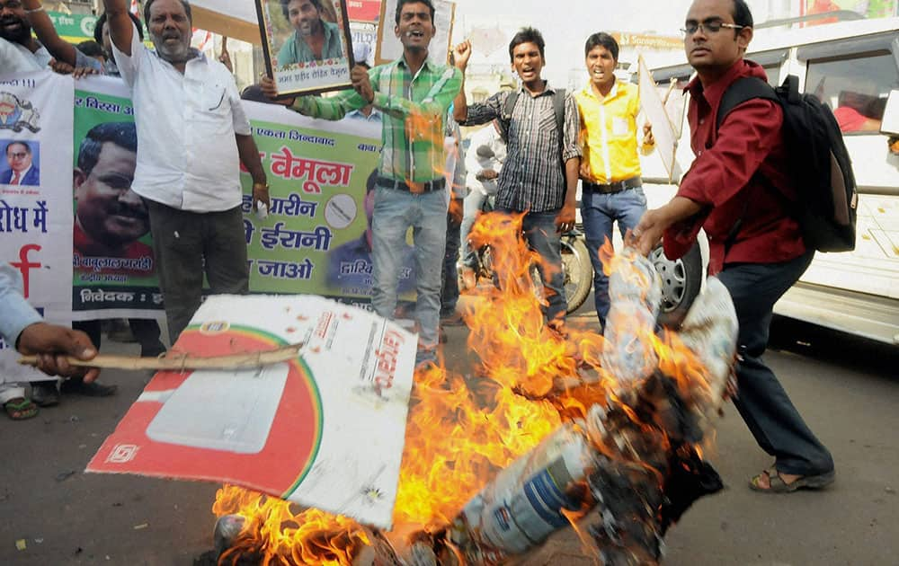 Jharkhand Vikas Morcha (JVM) student activists burn an effigy of Union HRD Minister Smriti Irani over the Rohith Vemula suicide case at Albert Ekka Chowk in Ranchi.