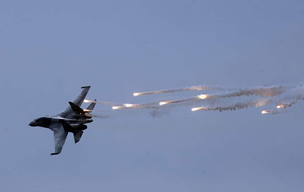 An Indonesian fighter jet releases flares during a show in Jakarta, Indonesia.