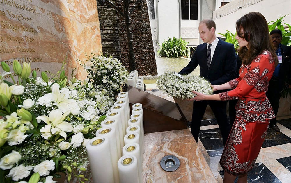 The Duke and Duchess of Cambridge, Prince William, and his wife, the former Kate Middleton lay a wreath on the martyrs memorial at the Taj Mahal Palace Hotel in Mumbai, India.