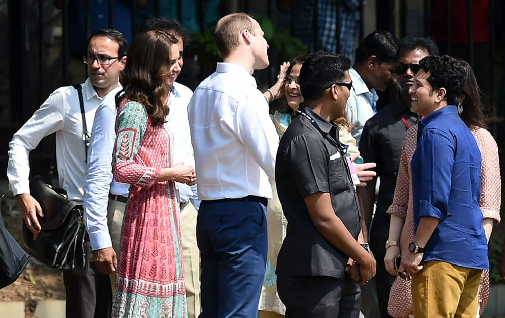 The Duke and Duchess of Cambridge, Prince William, center, and his wife, the former Kate Middleton, second left, speak with former Indian cricketer Sachin Tendulkar, right, during a charity event at the Oval Maidan in Mumbai, India.