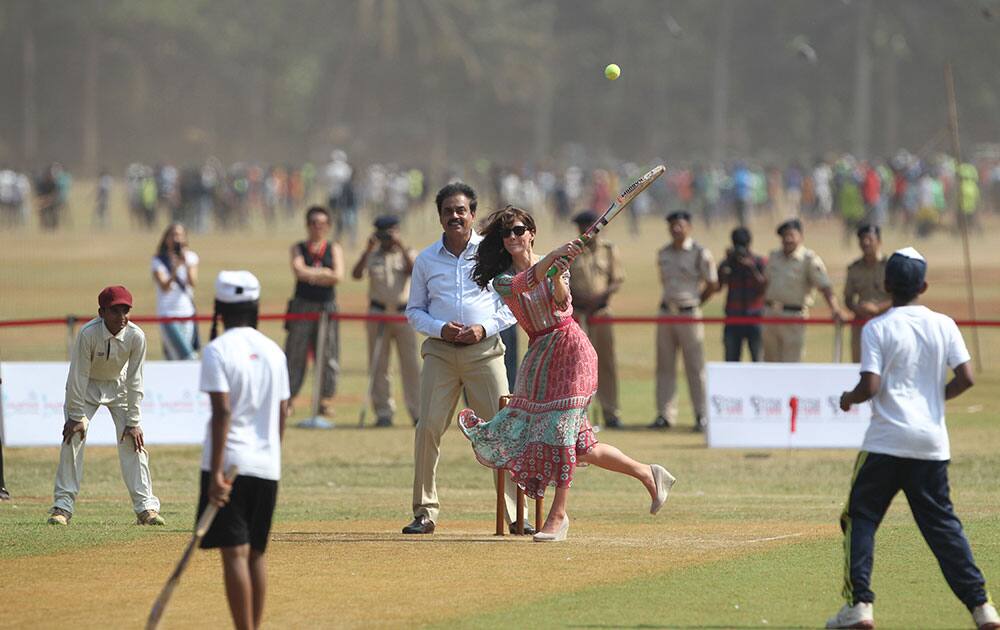 Britain's Kate, the Duchess of Cambridge, plays cricket at Oval Maidan in Mumbai, India.