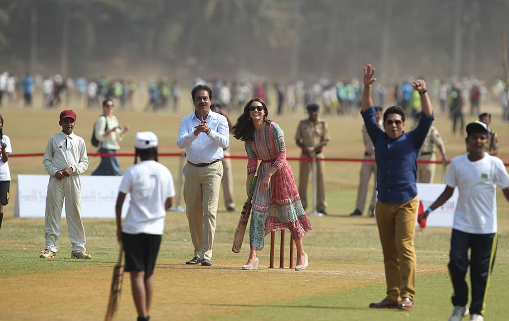 Britain's Kate, the Duchess of Cambridge, plays cricket at Oval Maidan in Mumbai, India.