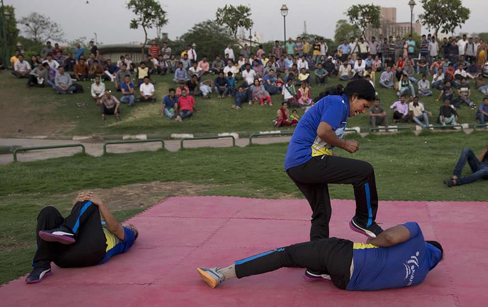 A police woman demonstrates how to defend oneself at an evening program organized by the Delhi Police to create awareness on women empowerment and self defense in New Delhi.