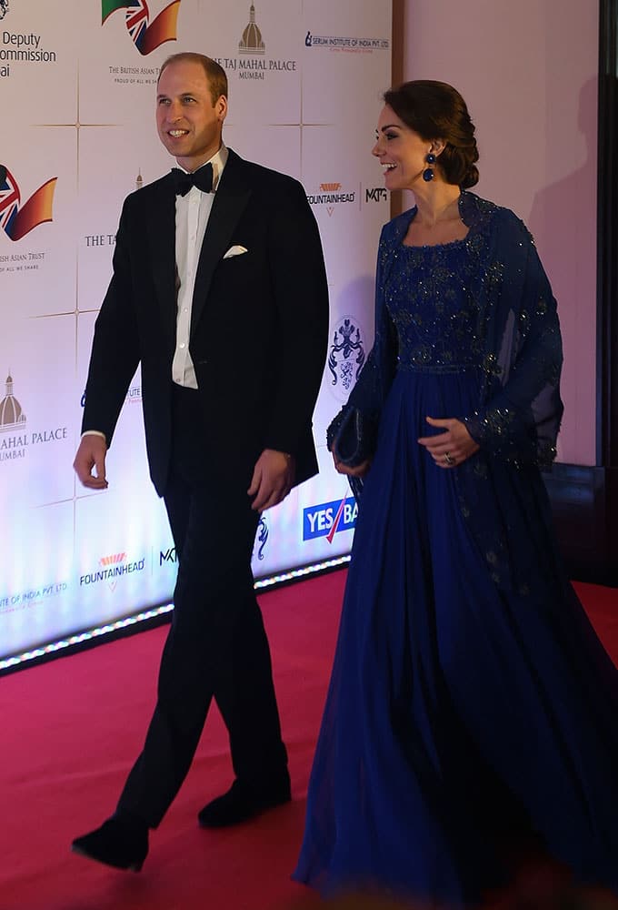 Britain's Prince William, and his wife, Kate, the Duchess of Cambridge, arrive for a charity ball at the Taj Mahal Palace hotel in Mumbai.