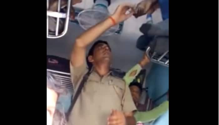 MUST WATCH: Video of policeman taking money from passengers in train goes viral