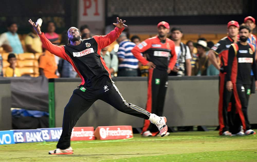 Royal Challengers Bangalore player Chris Gayle in action at a training session in Bengaluru.