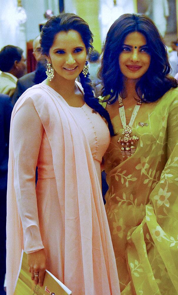 Priyanka Chopra who received Padma Shri award from President Pranab Mukherjee poses with tennis player Sania Mirza during civil investiture ceremony in New Delhi.