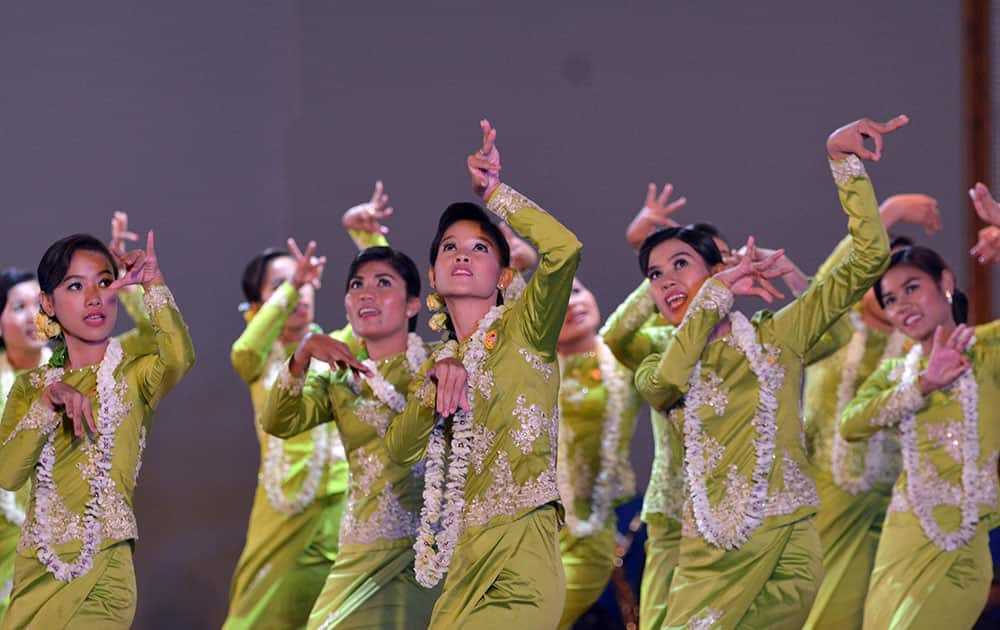 Myanmar performers present traditional dance during a ceremony to mark Myanmar water festival at the Presidential Palace.