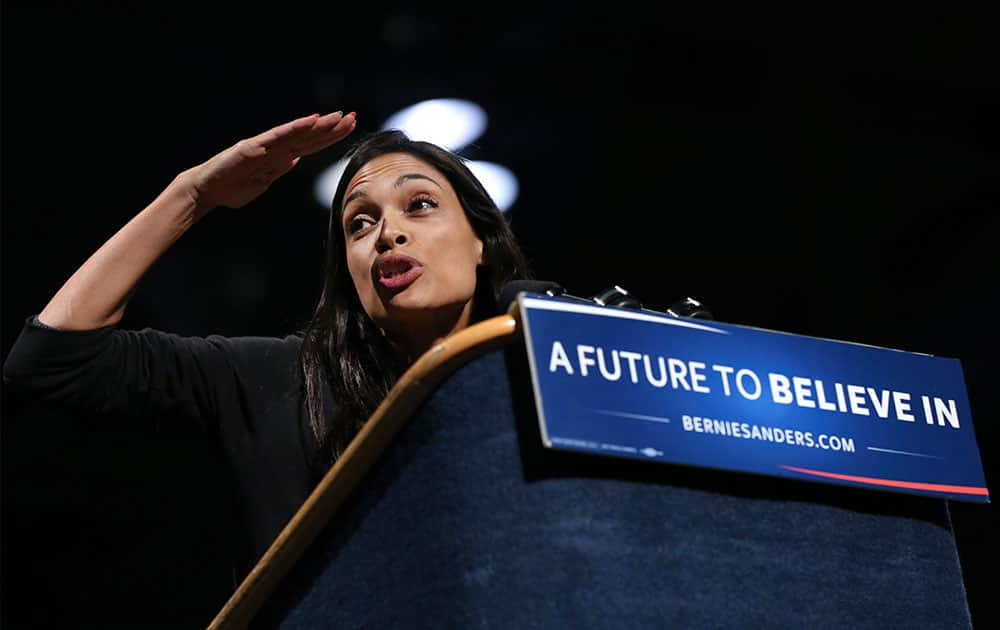 Actress Rosario Dawson looks out at the audience as she prepares to introduce Democratic presidential candidate, Sen. Bernie Sanders, I-Vt., at a campaign rally.