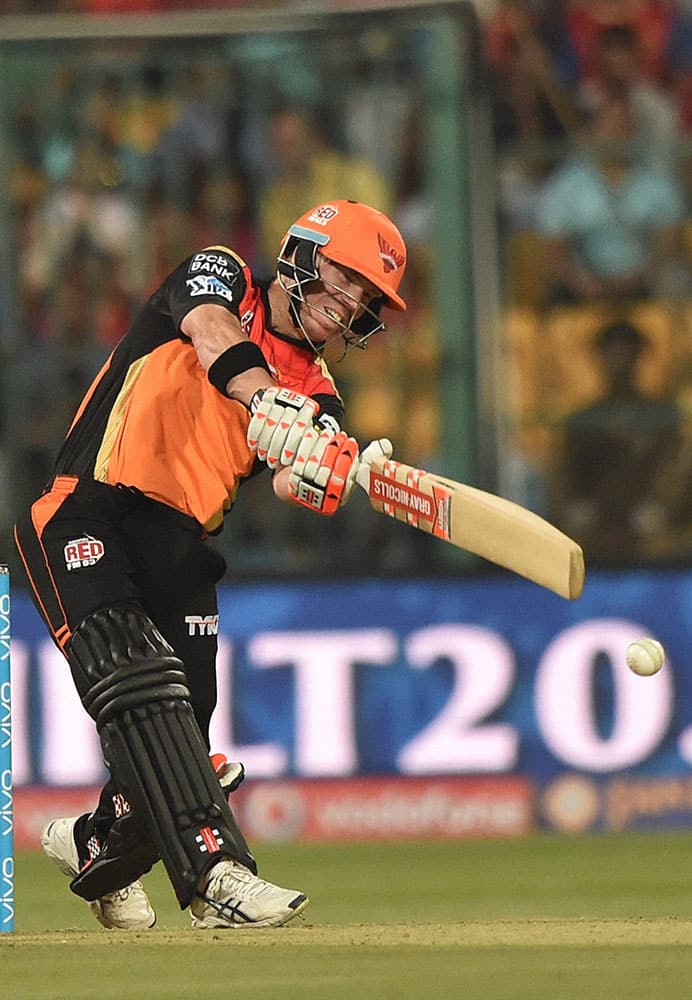 Sunrisers Hyderabad batsman David Warner plays a shot against Royal Challengers Bangalore during the IPL 2016 match at Chinnaswamy stadium in Bengaluru.