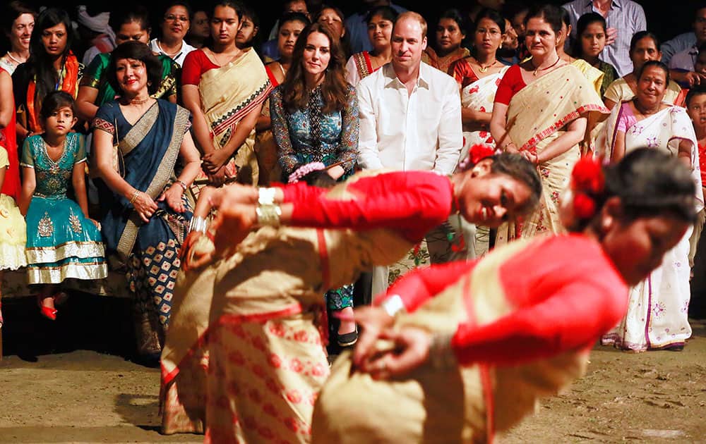 Britain's Prince William along with Kate, the Duchess of Cambridge watches Assamese traditional Bihu dance in Diphlu River Lodge in the Kaziranga National Park, Assam.