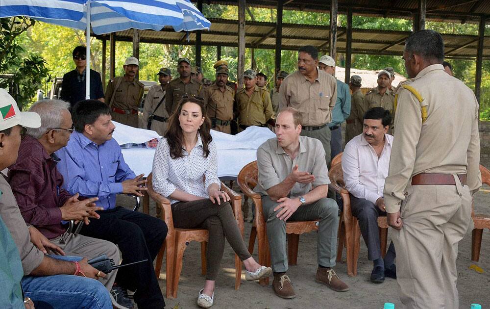Britain's Prince William and Kate, the Duchess of Cambridge talk with forest officials in the Kaziranga National Park, Assam.