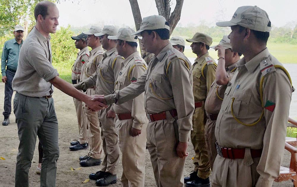 Britain's Prince William greets the forest officials in the Kaziranga National Park, Assam.