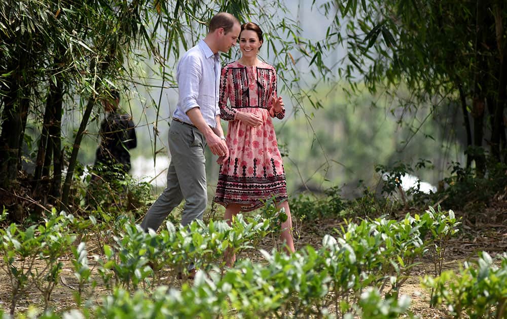 Britain's Prince William and Kate, the Duchess of Cambridge visit a village tea garden in Kaziranga, Assam.