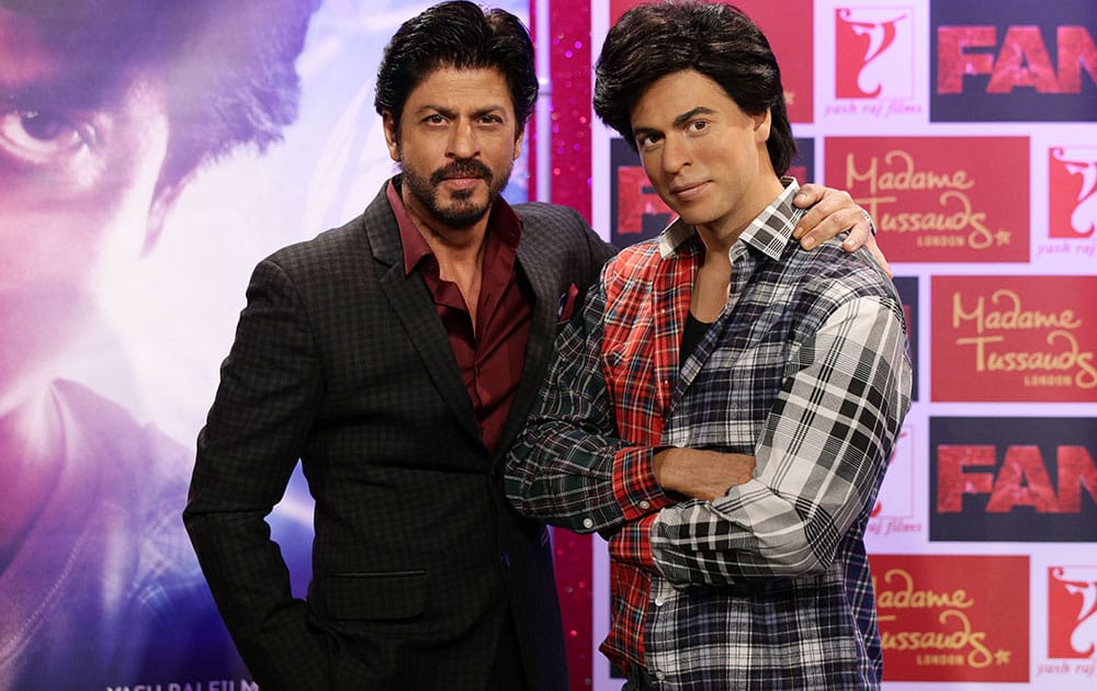 Shah Rukh Khan poses with his wax figure at Madame Tussauds in London.