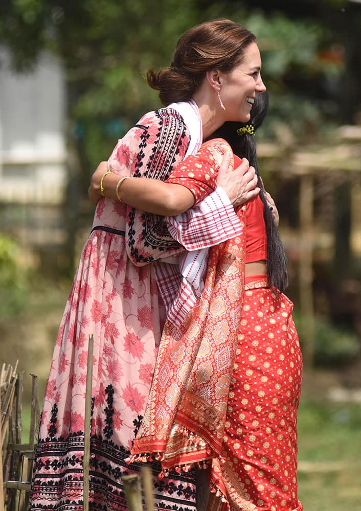 Britain's Kate, the Duchess of Cambridge, is greeted by an Indian resident at a village tea garden in Kaziranga, east of Gauhati, northeastern Assam state, India.