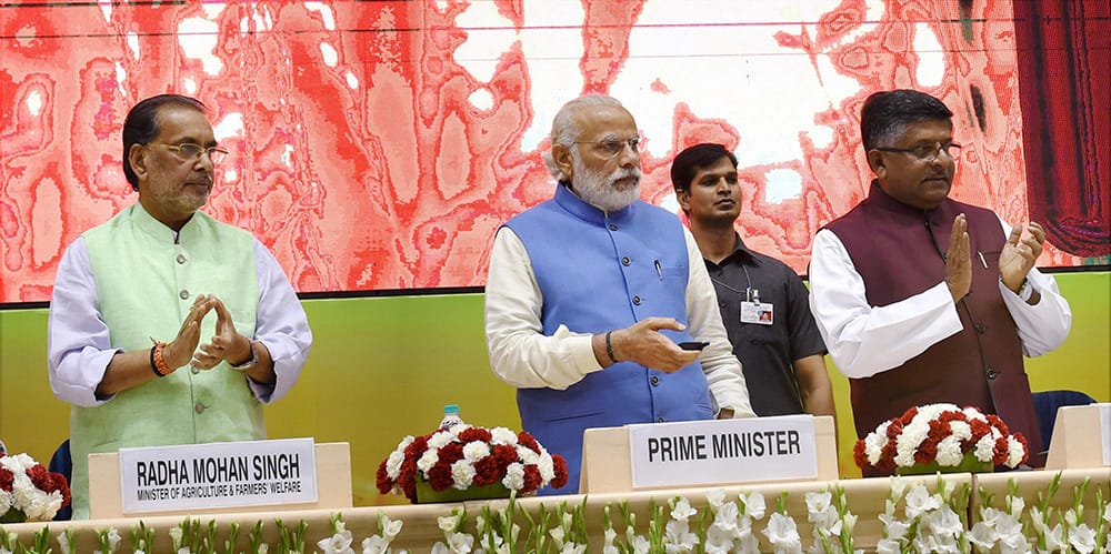 Prime Minister Narendra Modi with Union Agriculture and Farmers Welfare Minister, Radha Mohan Singh and Union Minister for Communications & IT, Ravi Shankar Prasad launches the National Agriculture Market, an e-market, in New Delhi.