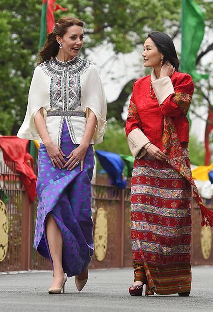 Britain's Kate Duchess of Cambridge, left, and The Queen of Bhutan Jetsun Pema walk during a visit to the Tashichho Dzong in Thimphu, Bhutan, during day five of the royal tour to India and Bhutan.