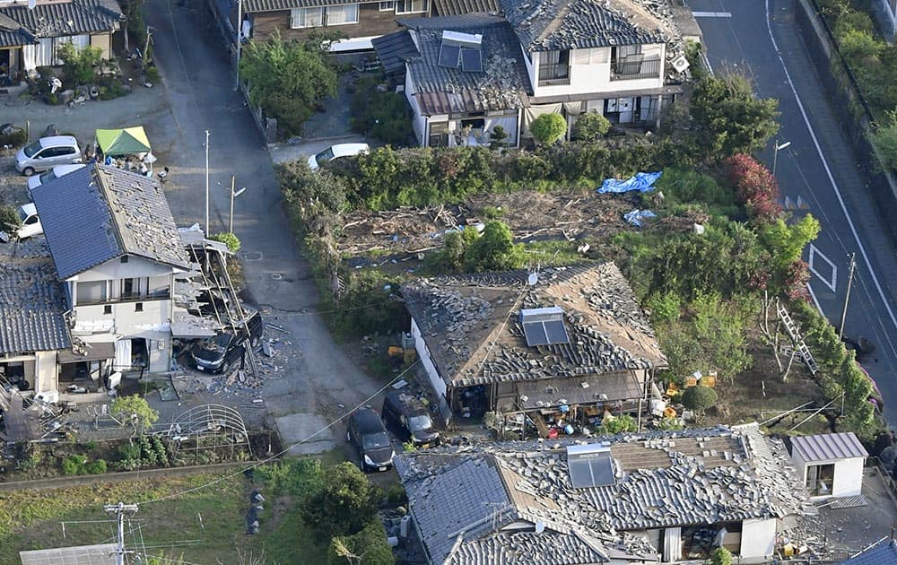 This aerial photo shows damaged houses in Mashiki, Kumamoto prefecture, southern Japan.