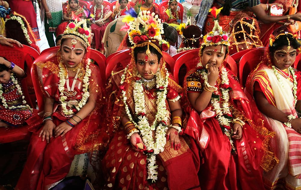 Young girls yet to attain puberty are dressed up as living goddesses before being worshipped as 'kumari' or virgin during the Bengali Hindu festival of Basanti Durga puja performed in the spring in Kolkata