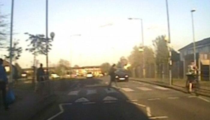 Shocking moment! Hit-and-run driver sends woman flying through air - Watch
