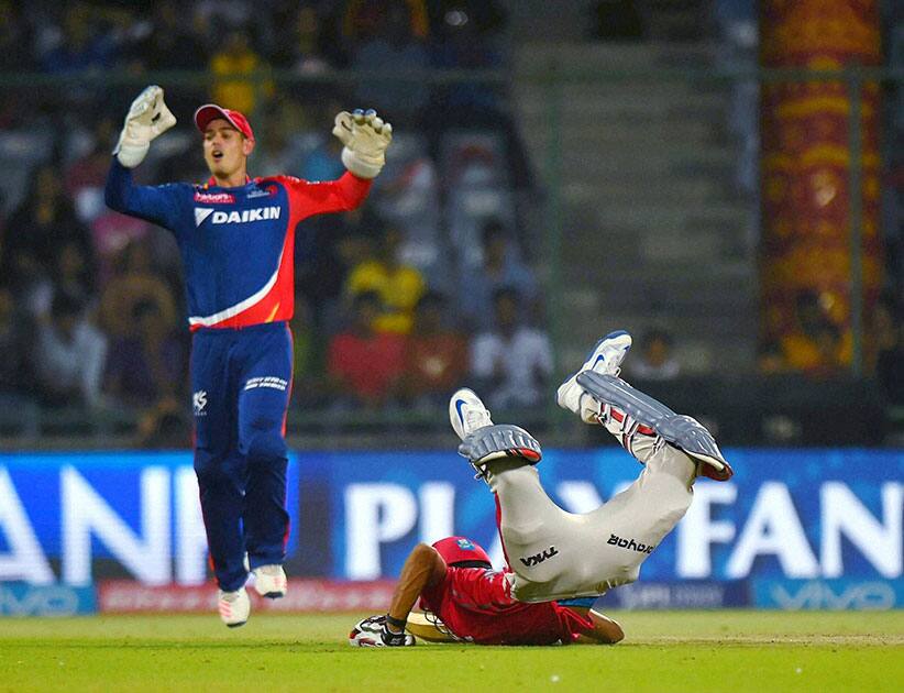 Kings XI Punjab batsman Axar Patel dives to complete the run against Delhi Daredevils during their IPL match at Feroz Shah Kotla Stadium in New Delhi.