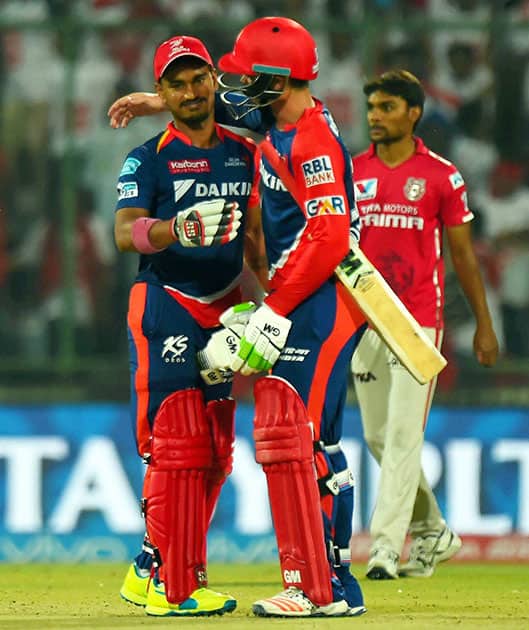 Delhi Daredevils batsman Quinton de Kock and Pawan Negi celebrate their win against Kings XI Punjab during their IPL match at Feroz Shah Kotla Stadium in New Delhi.
