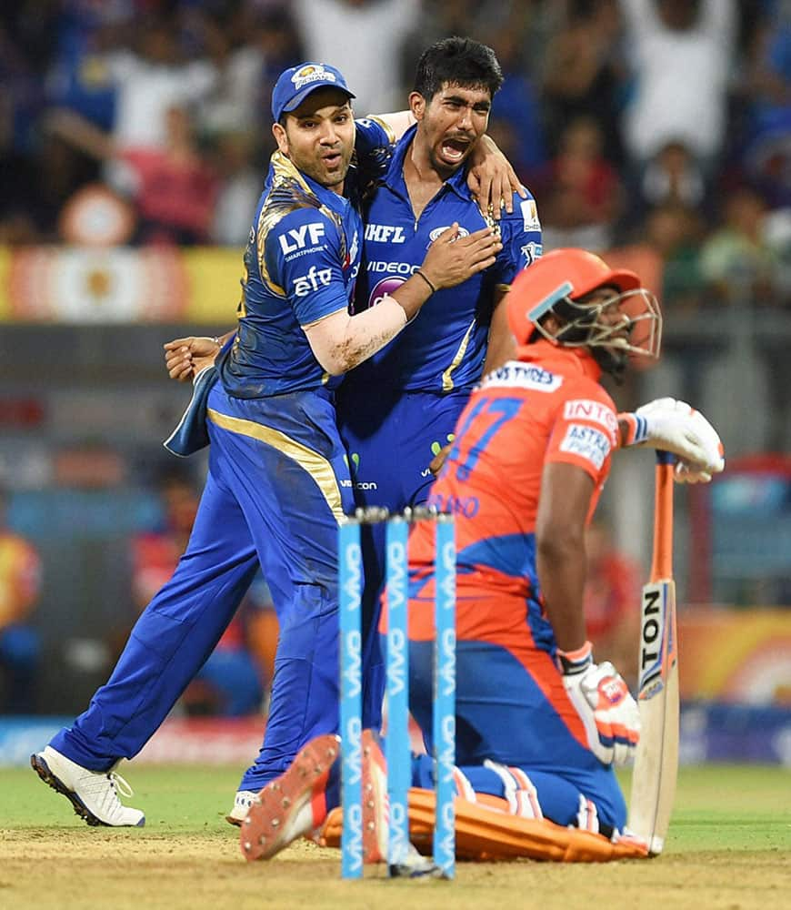 Mumbai Indians bowler Jasprit Bumrah celebrate the wicket of Gujrat Lions batsman Bravo during the IPL match in Mumbai.