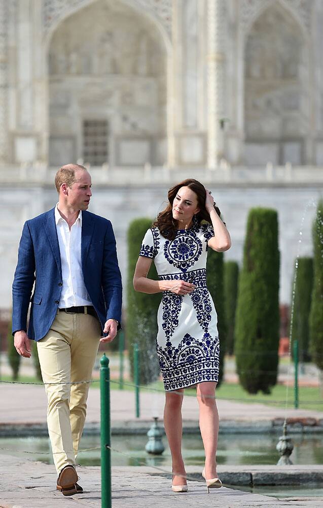 Britain's Prince William, along with his wife, Kate, the Duchess of Cambridge, walk during their visit to the Taj Mahal in Agra, India.