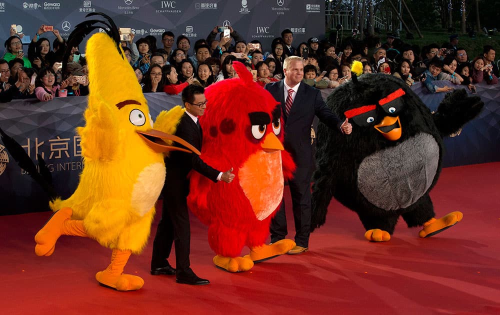 People dressed as characters from the Angry Birds movie pose for photos at the red carpet for the 6th Beijing International Film Festival, held on the outskirts of Beijing, China.