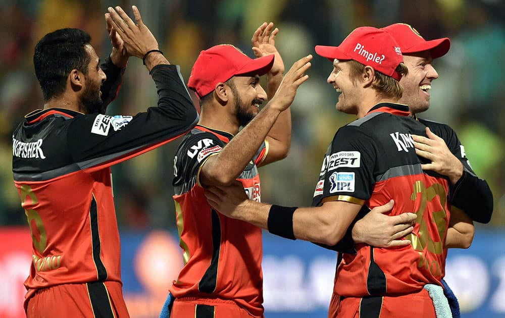 Royal Challengers Bangalore bowler S Arvind celebrate with Shane Watson and other team mates after dismissal of Shreyas Iyer of Delhi Daredevils during Indian Premier League (IPL) 2016 T20 match in Bengaluru.