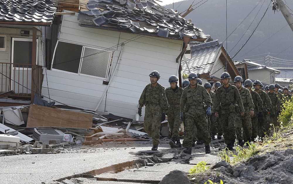 Japan Self-Defense Forces members work the damage area caused by earthquakes in Minamiaso, Kumamoto prefecture, Japan.