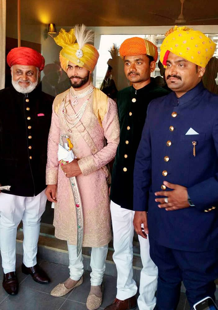  Indian cricketer Ravindra Jadeja with his relatives during his wedding ceremony in Rajkot.