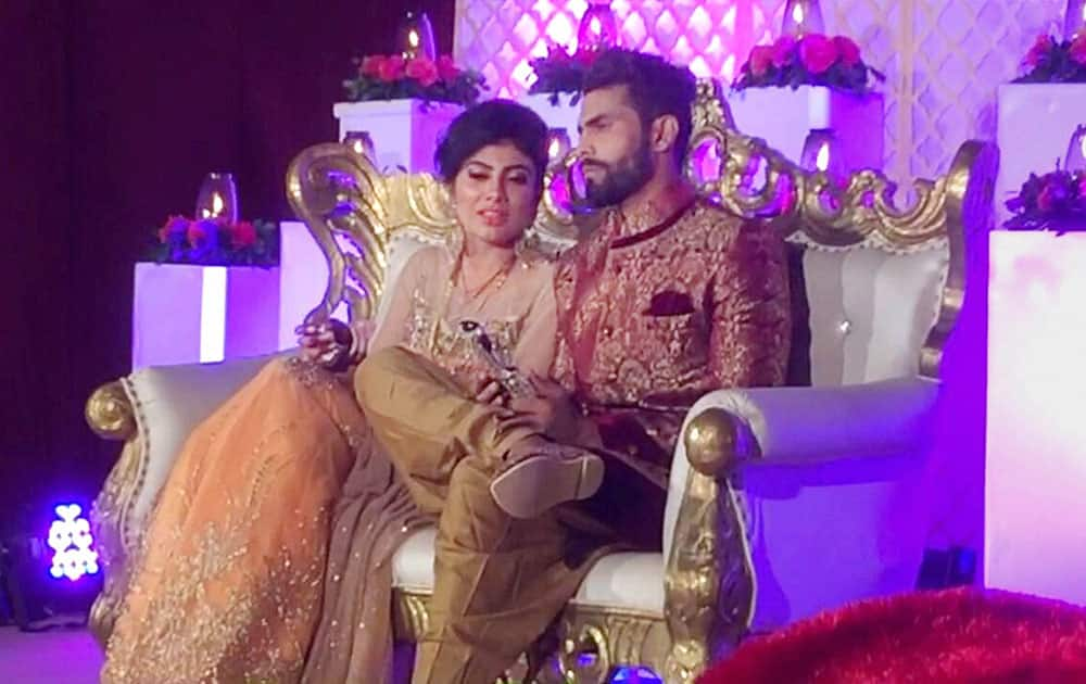 Cricketer Ravindra jadeja with his wife Rivaba during their wedding ceremony in Rajkot.