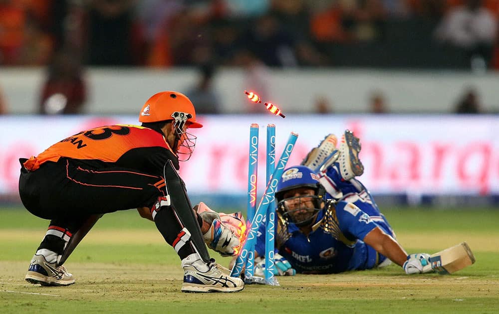 Sunrisers Hyderabads wicketkeeper Naman Ojha breaks the wickets to run out Mumbai Indians captain Rohit Sharma during Indian Premier League (IPL) 2016 T20 match in Hyderabad,