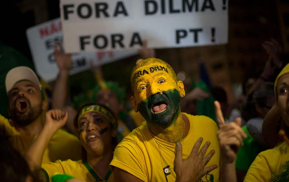 Anti-government demonstrators celebrate after the lower house of Congress voted to impeach Brazil's President Dilma Rousseff, on Copacabana beach in Rio de Janeiro, Brazil.