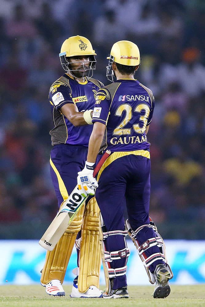 Robin Uthappa of Kolkata Knight Riders is congratulated by Kolkata Knight Riders captain Gautam Gambhir for reaching his fifty during the Indian Premier League (IPL) 2016 T20 match against Kings XI Punjab, in Mohali.