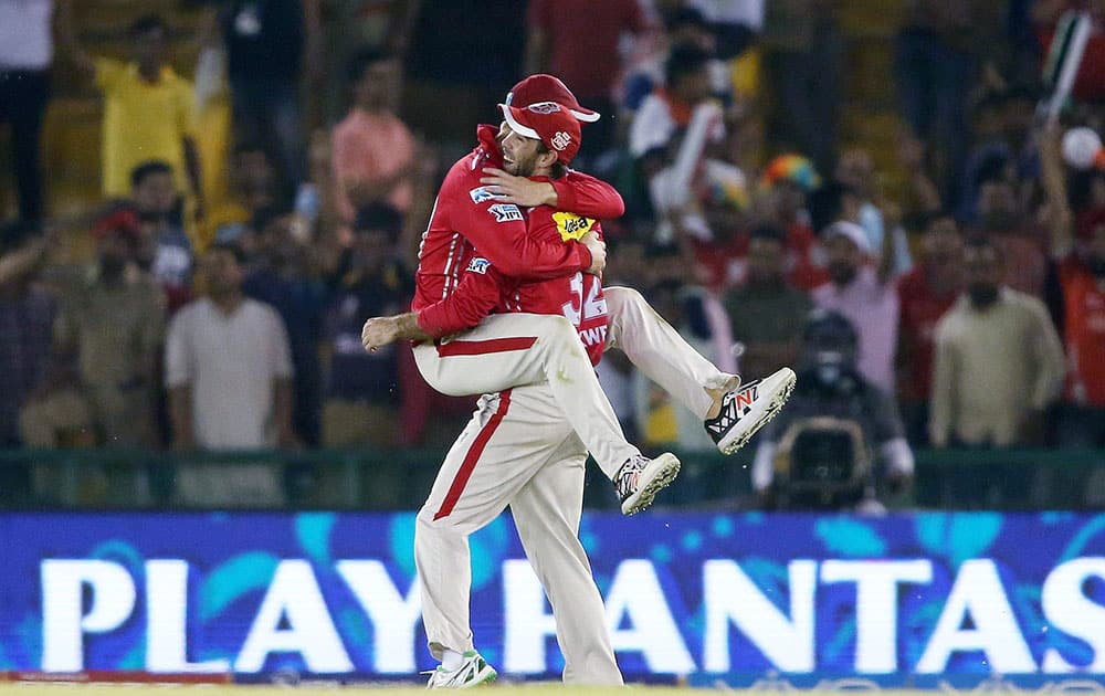 Kings XI Punjab captain David Miller congratulates Glenn Maxwell of Kings XI Punjab for taking the catch to get Kolkata Knight Riders captain Gautam Gambhir wicket during the Indian Premier League (IPL) 2016 T20 match, in Mohali.