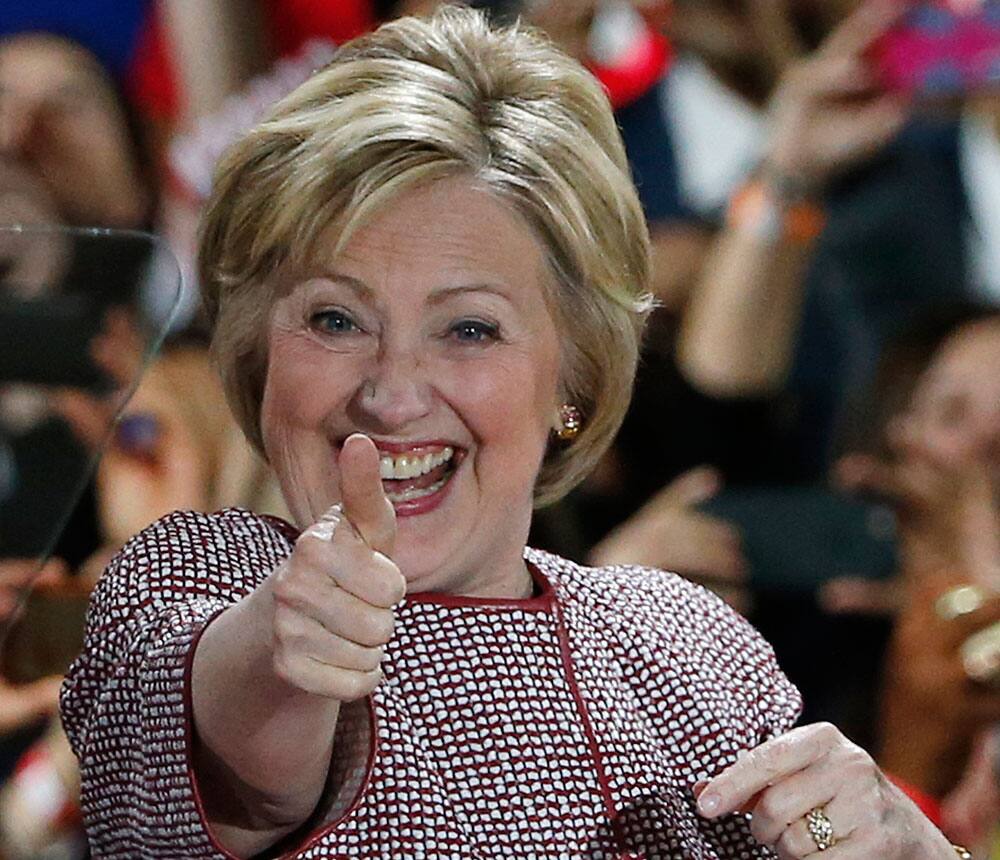 Democratic presidential candidate Hillary Clinton celebrates on stage after winning the New York state primary election.