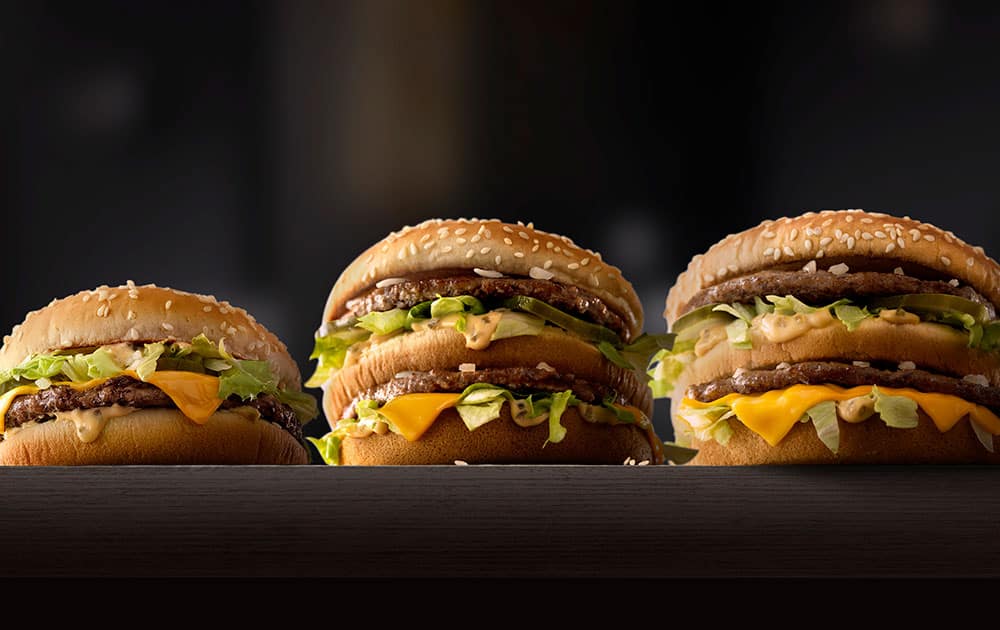 This photo provided by McDonald's shows, from left to right: McDonald's Mac Jr., Big Mac and Grand Mac. McDonald's is testing bigger and smaller versions of its Big Mac as the world's biggest hamburger chain pushes to revive its business.