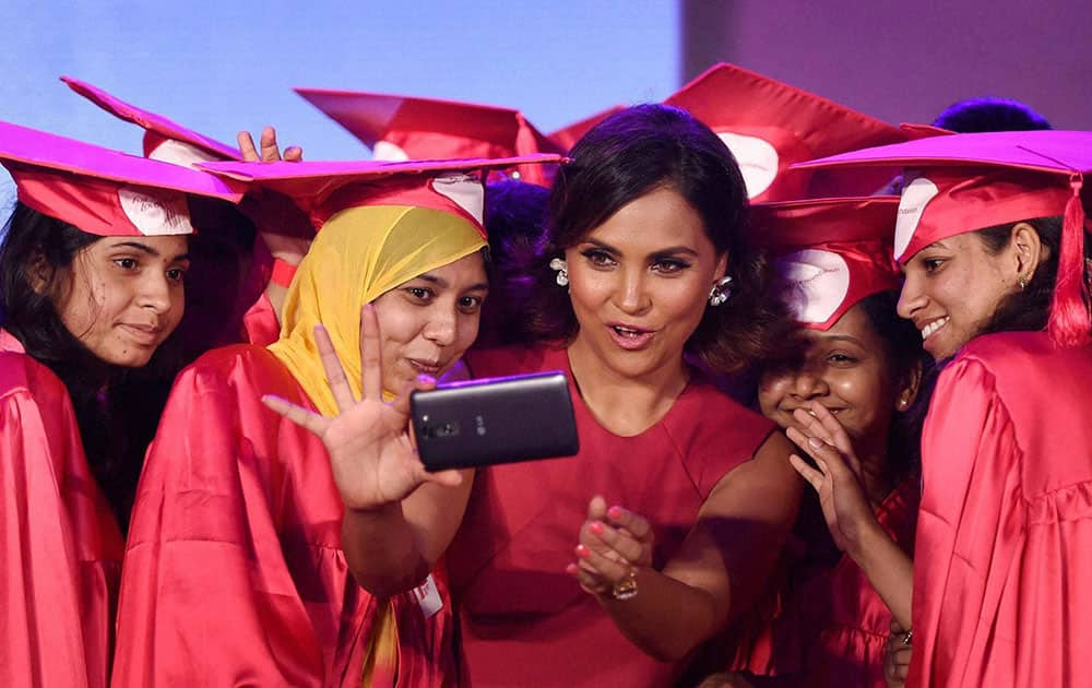 Bollywood actress Lara Dutta taking selfie with the girls who were presented scholarships by the Fair & Lovely Foundation in Mumbai.