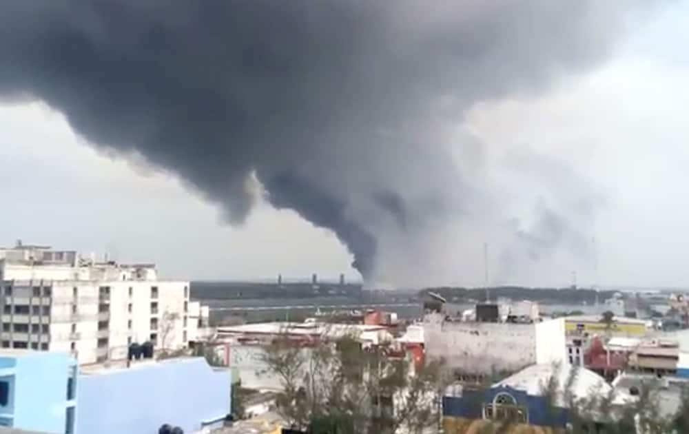 a large plume of smoke rises from the Mexican State oil company Petroleos Mexicanos' petrochemical plant after an explosion in Coatzacoalcos, Mexico.