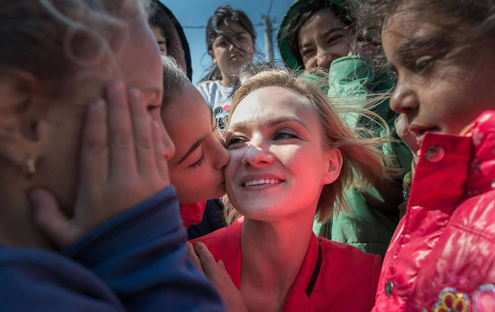 Prima Ballerina of the St Petersburg Ballet Company, Irina Kolesnikova meets refugees at the Tabanovce refugee camp in Macedonia near the Serbian border.