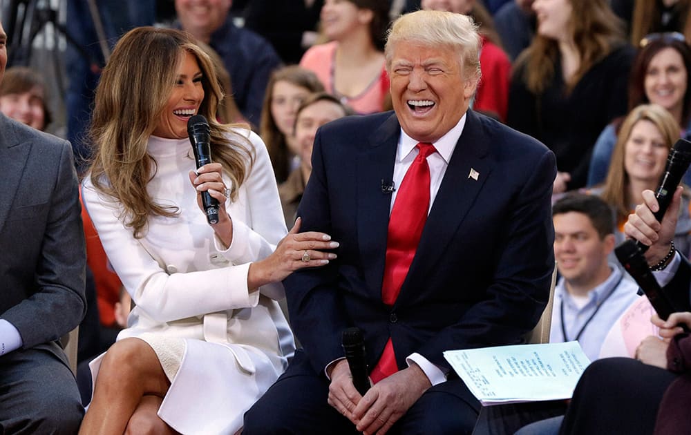 Republican presidential candidate Donald Trump reacts as his wife Melania Trump, answers a question during an interview on the NBC Today television program, in New York.