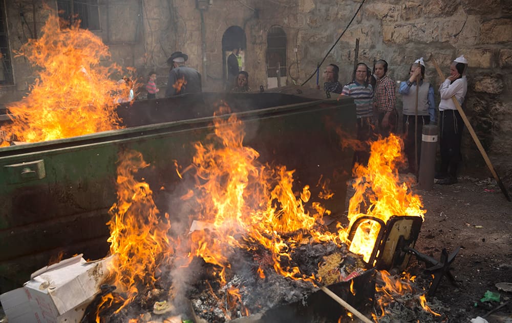 Ultra-Orthodox Jewish men and children burn leavened items in final preparation for the Passover holiday in Jerusalem.