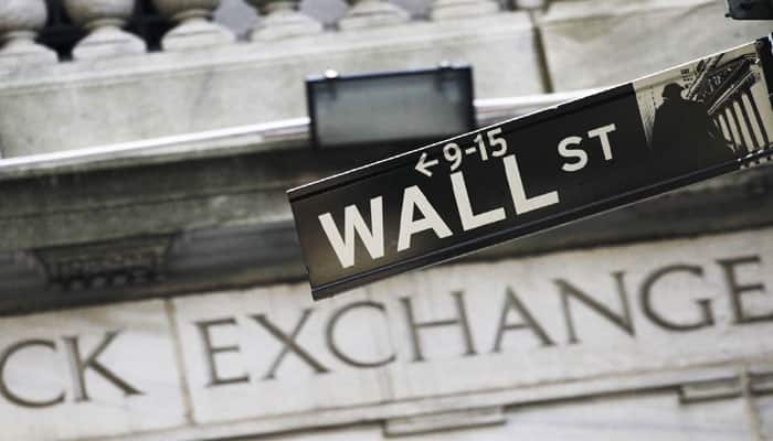  Earnings drag Wall Street lower even as oil steadies 