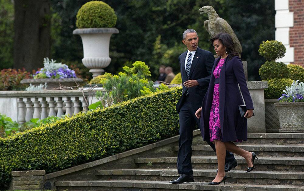 President Barack Obama and first lady Michelle Obama walk from Winfield House in London en route to Windsor Castle in Windsor, England.