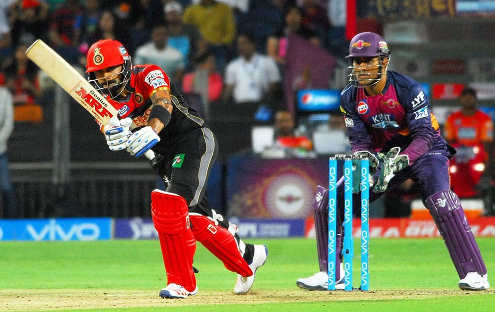 Royal Challengers Bangalore captain Virat Kohli plays a shot against Rising Pune Supergiants during their IPL match at the Maharashtra Cricket Associations International Stadium.